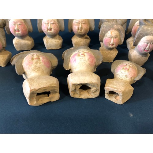 1048A - Nineteen Chinese Figurative Items: Seventeen Tang type court lady heads, a carved and polychrome pai... 