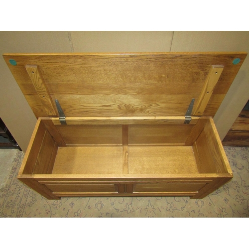 2214 - Good quality reproduction oak coffer / blanket chest with hinged lid, the front elevation enclosing ... 