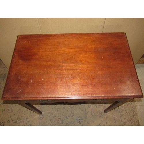 2256 - A Georgian mahogany side table with frieze drawer over a shaped apron raised on square cut and mould... 