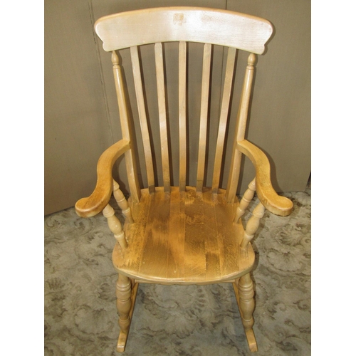 2289 - A modern Windsor beechwood lathe back rocking chair