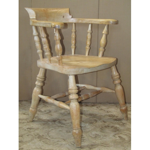 2295 - A traditional stained beechwood smokers bow elbow chair