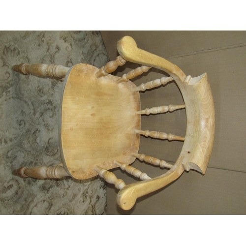 2295 - A traditional stained beechwood smokers bow elbow chair