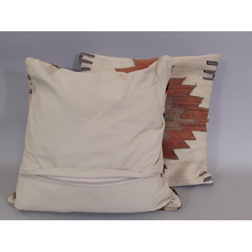 1604 - 2 cushions with cover made from old kelim and with new backing and zip opening, both 51x51cm (2)