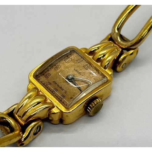 1361 - A ladies dress watch with 18k casework, square dial, and gold plated strap