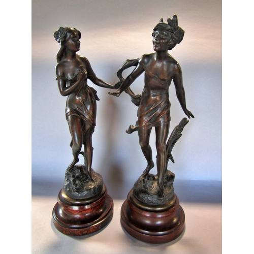 1453 - Two spelter classical figures, a boy and a girl, after Charles Theodore Perron, both raised on socle... 