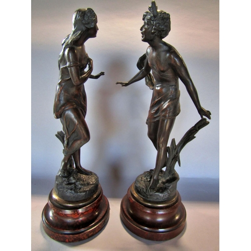 1453 - Two spelter classical figures, a boy and a girl, after Charles Theodore Perron, both raised on socle... 