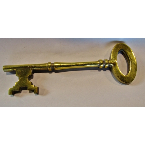 1458 - A miscellaneous collection of items including, a mahogany pipe stand, a large brass key 36cm, two pa... 