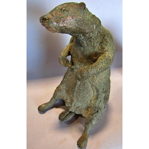 1476 - A brass figure of a badger, a brass bull’s head and a carved wood head of a falcon. 3