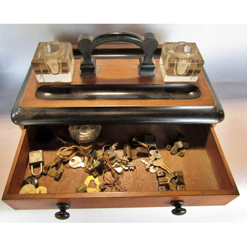 1483 - Two Victorian walnut and ebonised desk pen and ink stands.