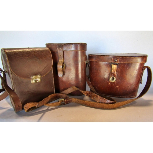 1489 - Three pairs of vintage binoculars in their original leather cases, together with Africa Star 39-45 w... 