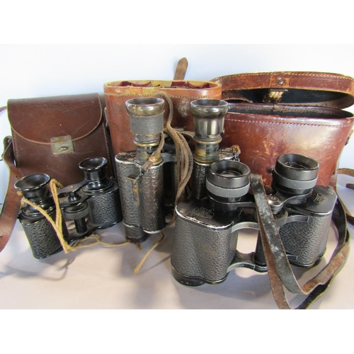 1489 - Three pairs of vintage binoculars in their original leather cases, together with Africa Star 39-45 w... 