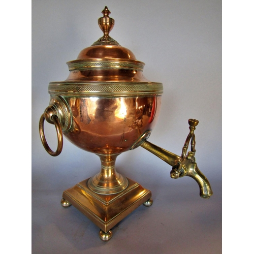 1508 - An elegant 19th century copper urn shaped samovar, raised on a square platform on ball supports, 36c... 