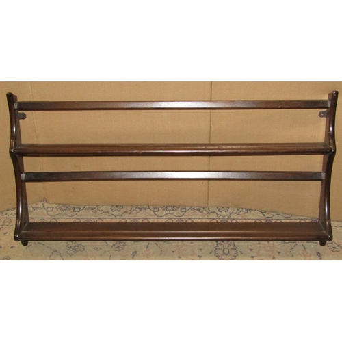 2395 - An Ercol dark stained elm two tier wall mounted plate rack with shaped outline 97 cm wide x 50 cm hi... 