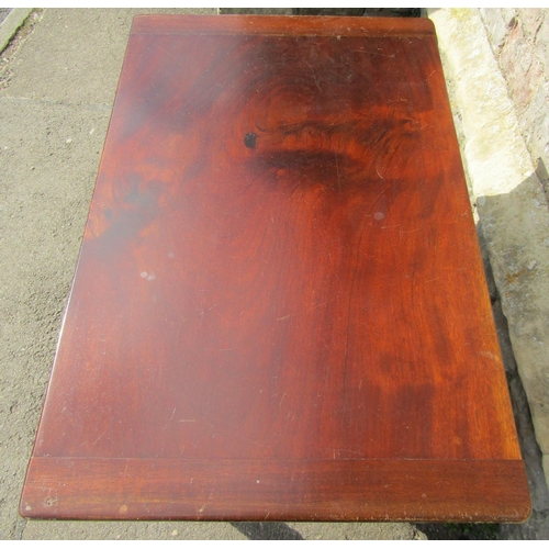 2398 - A Victorian mahogany rectangular fold over top table raised on turned supports with brass caps and c... 