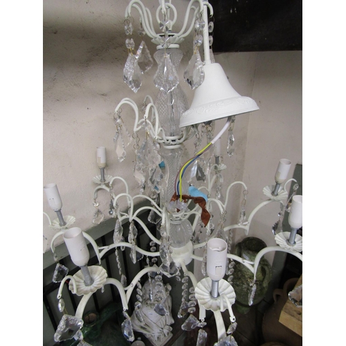 2400 - A contemporary eight branch cream painted light metal chandelier with moulded glass stem and faceted... 