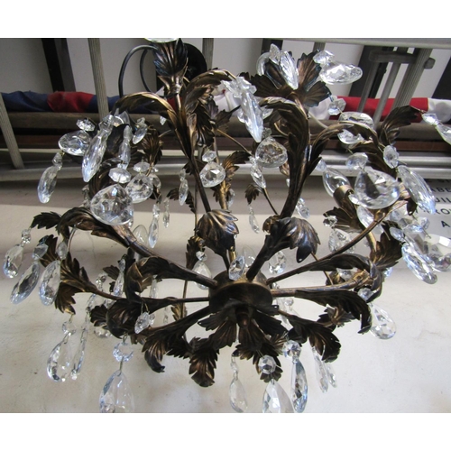 2403 - A contemporary light metal chandelier with five candle bulb fittings scrolling leaf detail, faceted ... 