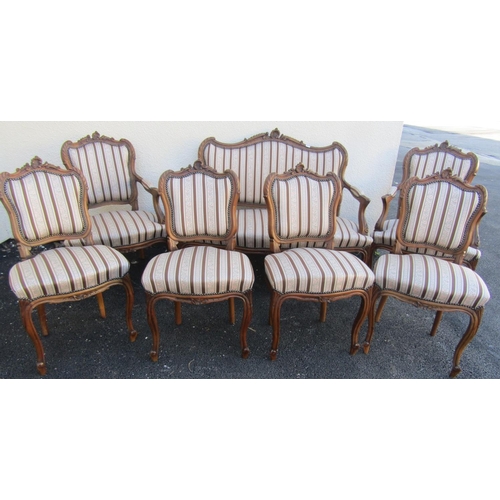 2413 - A seven piece salon suite comprising sofa, two armchairs, four singles chairs, all with carved and m... 