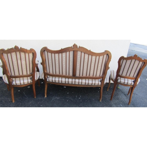 2413 - A seven piece salon suite comprising sofa, two armchairs, four singles chairs, all with carved and m... 