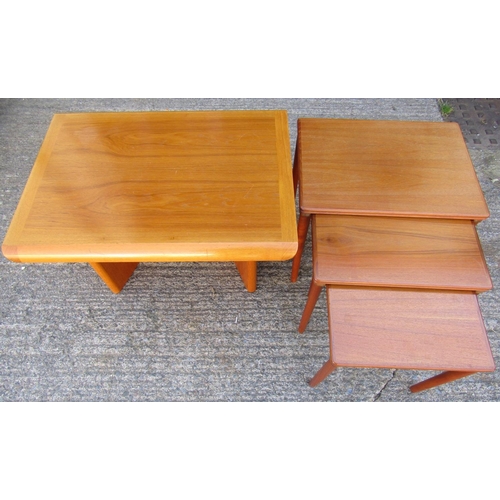 2417 - A nest of three graduated teak wood occasional tables on turned supports and a further teak wood tab... 