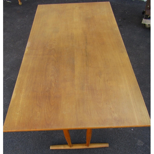 2419 - A mid-20th century beechwood refectory table of simple construction the plank top raised on turned s... 