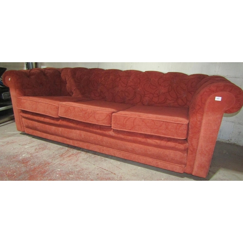 2423 - A traditional three seat Chesterfield style sofa by Wesley Barrell with buttoned back and arms, thre... 