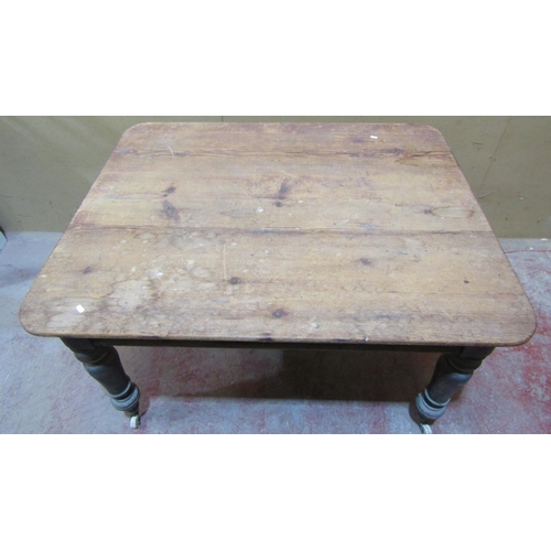 2435 - A Victorian scrubbed pine kitchen table on four turned supports, 125cm x 100cm to seat six, together... 