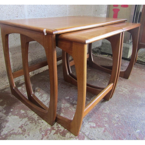 2439 - A nest of three mid 20th century teak wood occasional tables, 81cm x 46cm