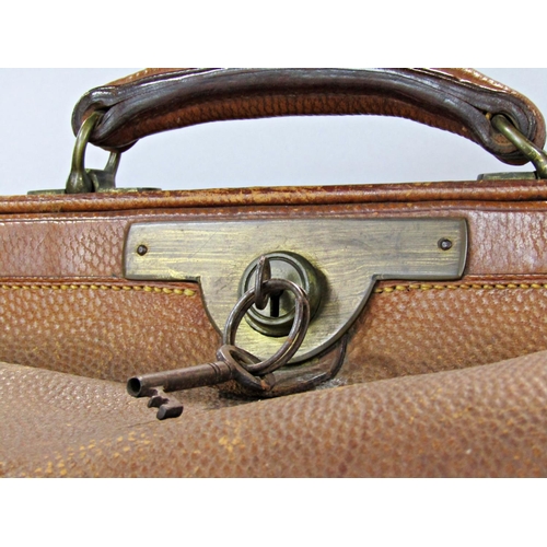 1535 - A vintage leather Gladstone bag with decent stitching and a large vintage Pukka suitcase.