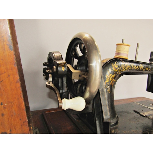 1539 - A vintage table top sewing machine, make unknown, with a walnut and mahogany inlaid case.