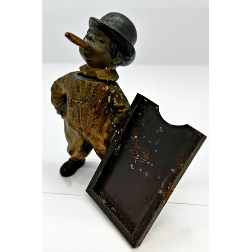 1404 - Vintage spelter advertising figure in the form of a young boy in dungarees smoking a large cigar and... 