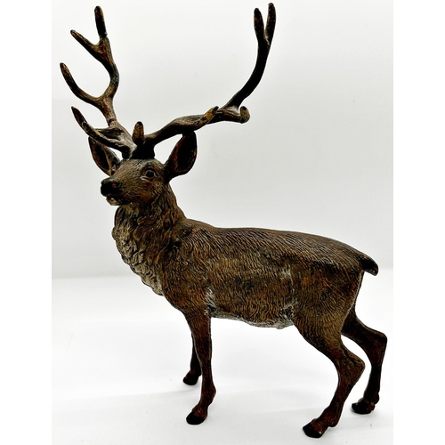 1405 - A spelter figure of a stag with antlers, naturalistically painted together with a small cold cast br... 