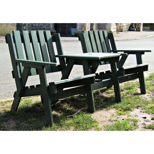 2012 - A green stained rustic wooden love/companion seat with slatted framework, 165cm long