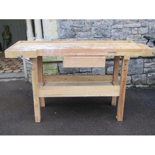 2059 - A Whitegate light beechwood work bench, incorporating a central frieze drawer and vices, 152cm wide ... 