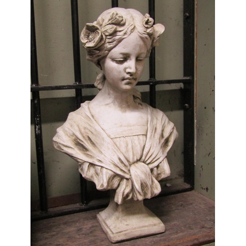 2070 - A cast composition stone (to simulated marble) bust of a maiden with flowers in her hair, 47cm high