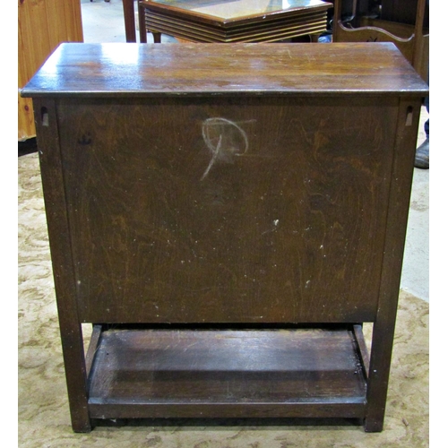 2175 - Reproduction old English style low oak side cupboard enclosed by a pair of linen fold panelled doors... 