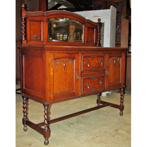 2194 - 1920s Jacobean revival oak mirror backed sideboard, with applied fretwork and further split moulding... 