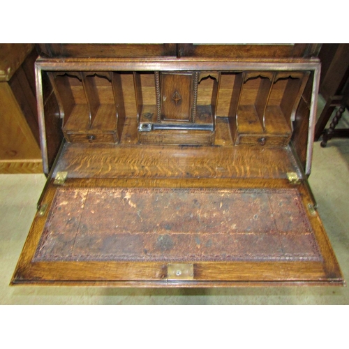 2196 - Good quality 1920s Jacobean revival oak bureau bookcase, with geometric, split moulded blind fret an... 