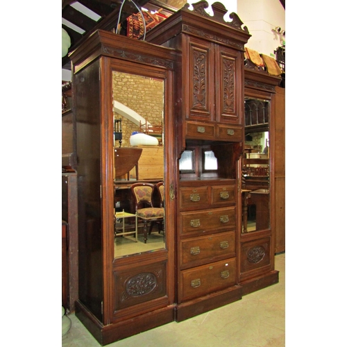 2221 - Edwardian walnut bedroom pair comprising a triple compactum wardrobe enclosed by an arrangement of c... 