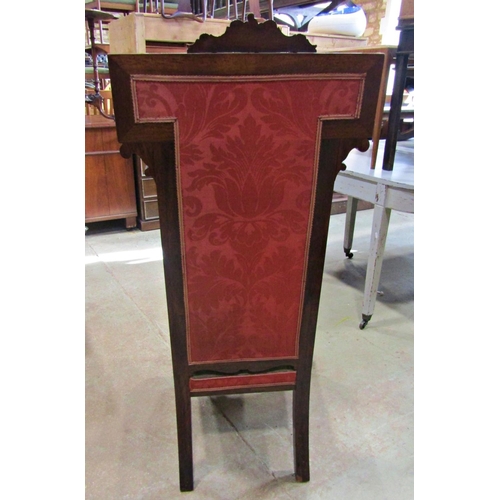 2240 - A Victorian rose wood predu, with floral tapestry upholstered seat and T shaped back within a show w... 