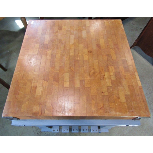 2263 - A butchers block, mounted on a substantial painted portable stand, 61cm square x 100cm high