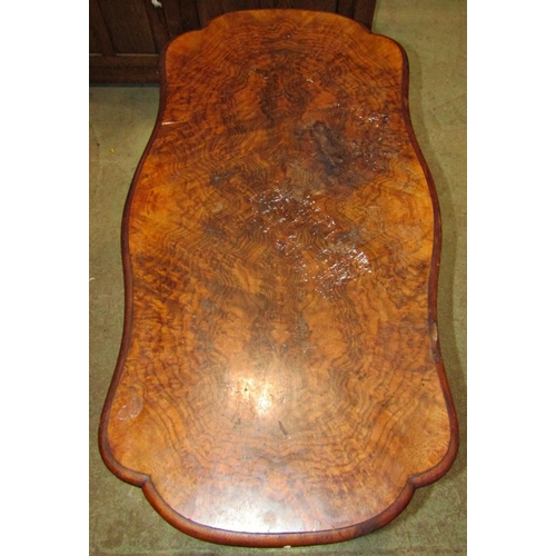 2264 - A Victorian walnut and figured walnut veneered occasional table with serpentine moulded outline, rai... 