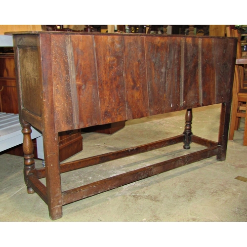 2272 - A good quality reproduction Old English style oak dresser base, the front elevation with carved and ... 