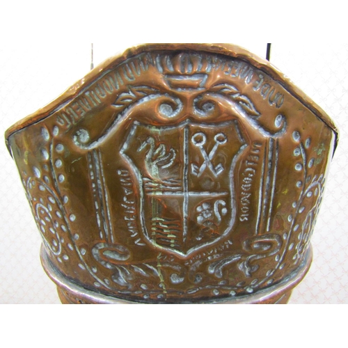 2632 - A 19th century French cooper grape hod, the raised back with hammered armorial, leather strap work, ... 