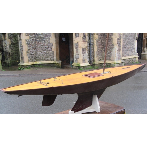 367 - Large scratch built wooden pond yacht on a stand, with single mast, opening deck hatch, simulated pl... 