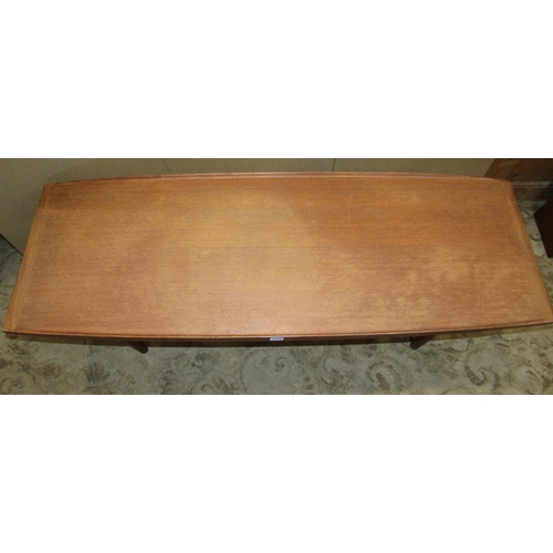 2306 - A retro teak occasional table with moulded outline, raised on simple turned legs united by stretcher... 