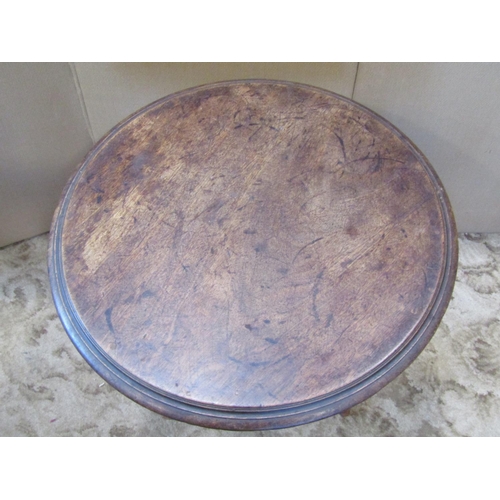 2331 - A Victorian mahogany occasional table the circular top with moulded outline raised on a turned pilla... 