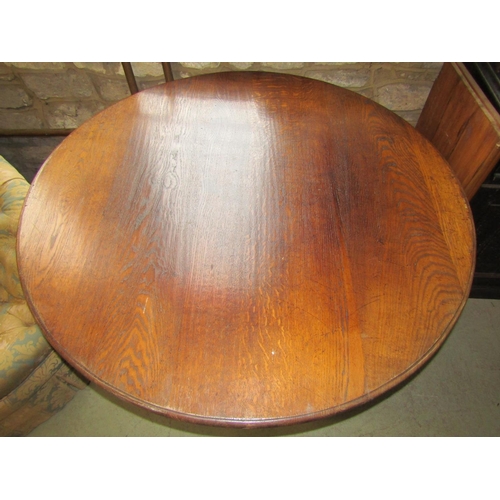 2332 - A reproduction Georgian style breakfast table, the circular top with moulded outline raised on a tur... 