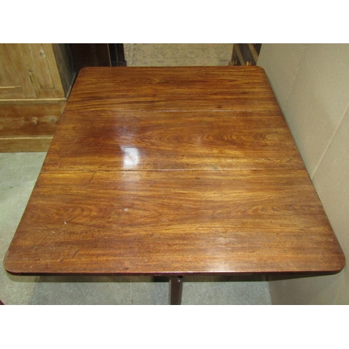 2340 - A Georgian mahogany drop leaf dining table of rectangular form, raised on six square cut and moulded... 