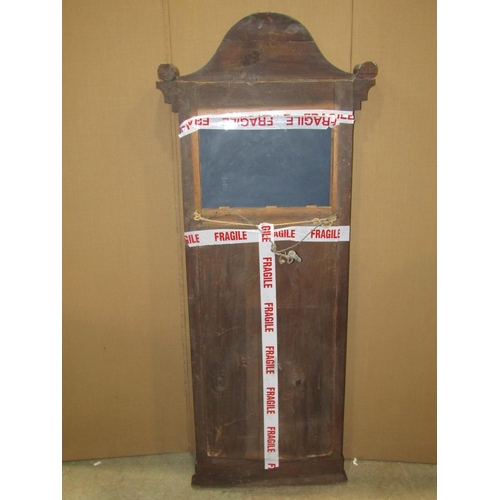 2368 - A 19th century mahogany pier mirror enclosing a rectangular plate beneath an arched and scrolled ped... 