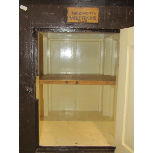 2381 - A vintage rustic painted wooden low side cupboard enclosed by a rectangular panelled door set on cas... 